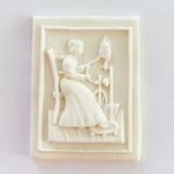 woman at spinner springerle cookie mold